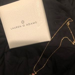 Gold tone necklace with multi colored stones.